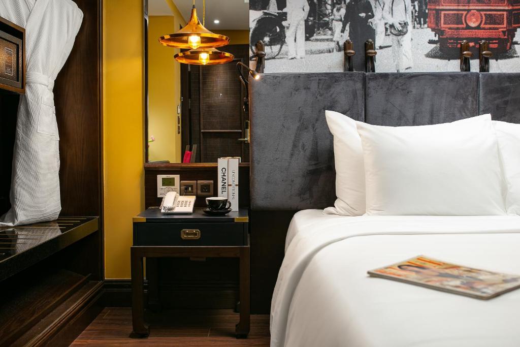 Postel nebo postele na pokoji v ubytování Hanoi Lion Boutique Hotel & Spa