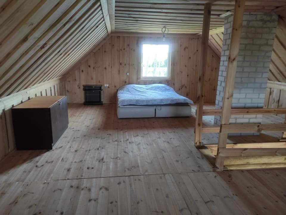 Postel nebo postele na pokoji v ubytování Smetoniškių sodyba