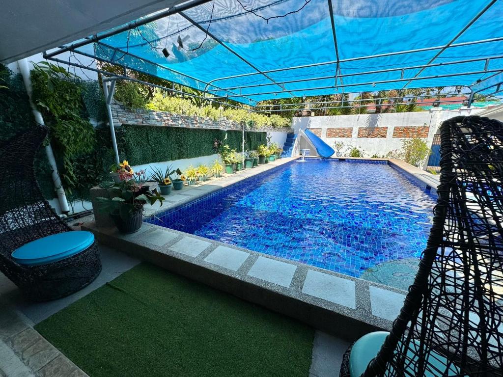 an overhead view of a swimming pool in a house at CozyVilla at Villa Astudillo Pansol Private Hotspring Resort in Calamba