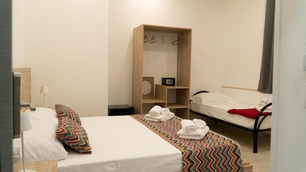 Postel nebo postele na pokoji v ubytování Frontemare 25 Beach Hotel