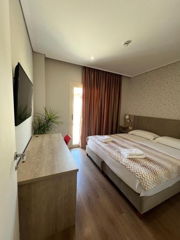 Letto o letti in una camera di CLASS Hotel