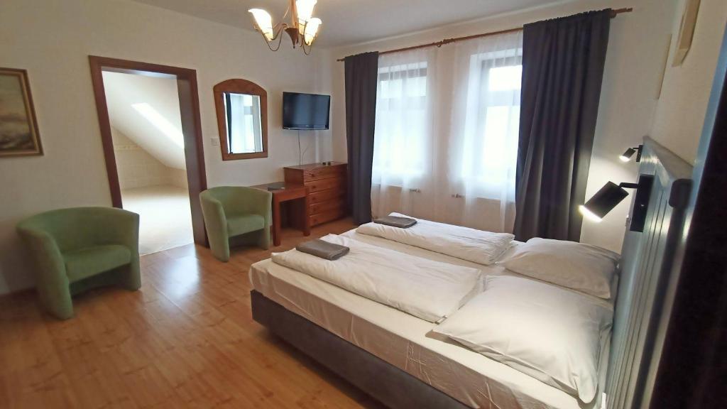 Postel nebo postele na pokoji v ubytování Folwark Na Półwyspie