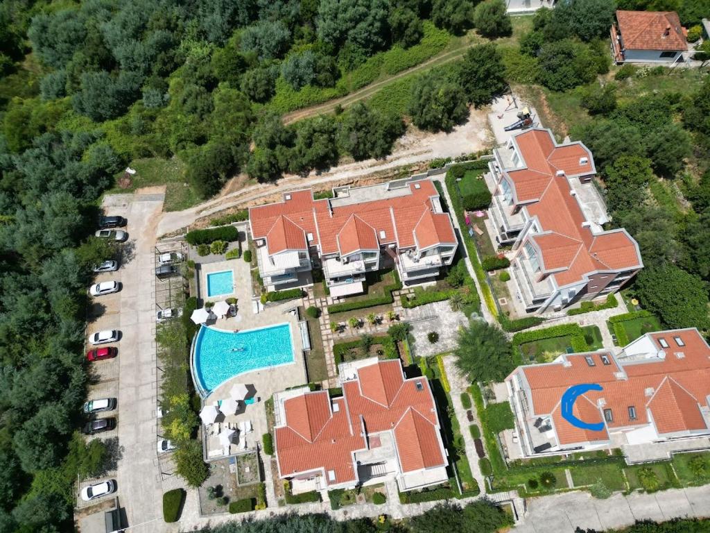 an aerial view of a house with a pool at Acacia Hill Apartment C01 with shared pool in Đenovići