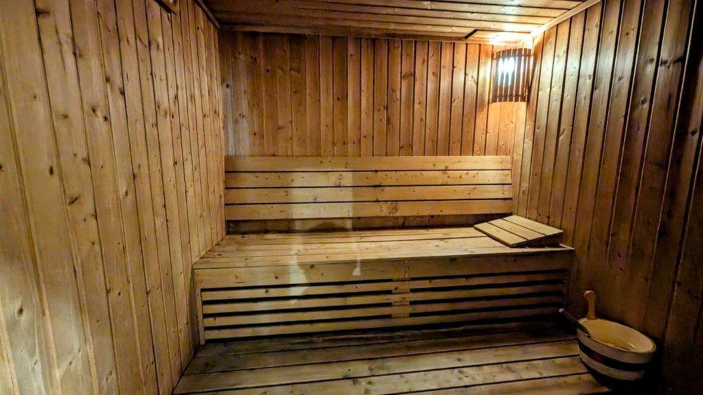 an empty wooden sauna with a toilet in it at City Tower Hotel in Fujairah
