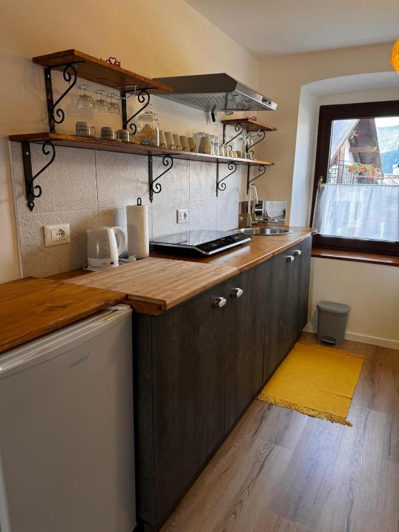 Kuchyň nebo kuchyňský kout v ubytování CASA DI MONTAGNA BnB -ROXY