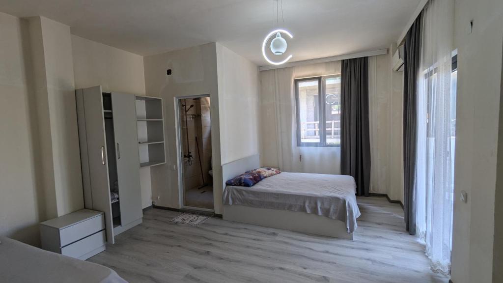 Postel nebo postele na pokoji v ubytování Hotel Palm Gonio