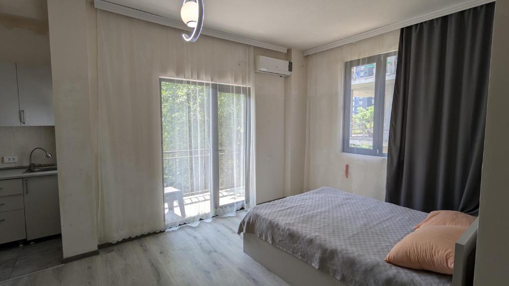 Postel nebo postele na pokoji v ubytování Hotel Palm Gonio