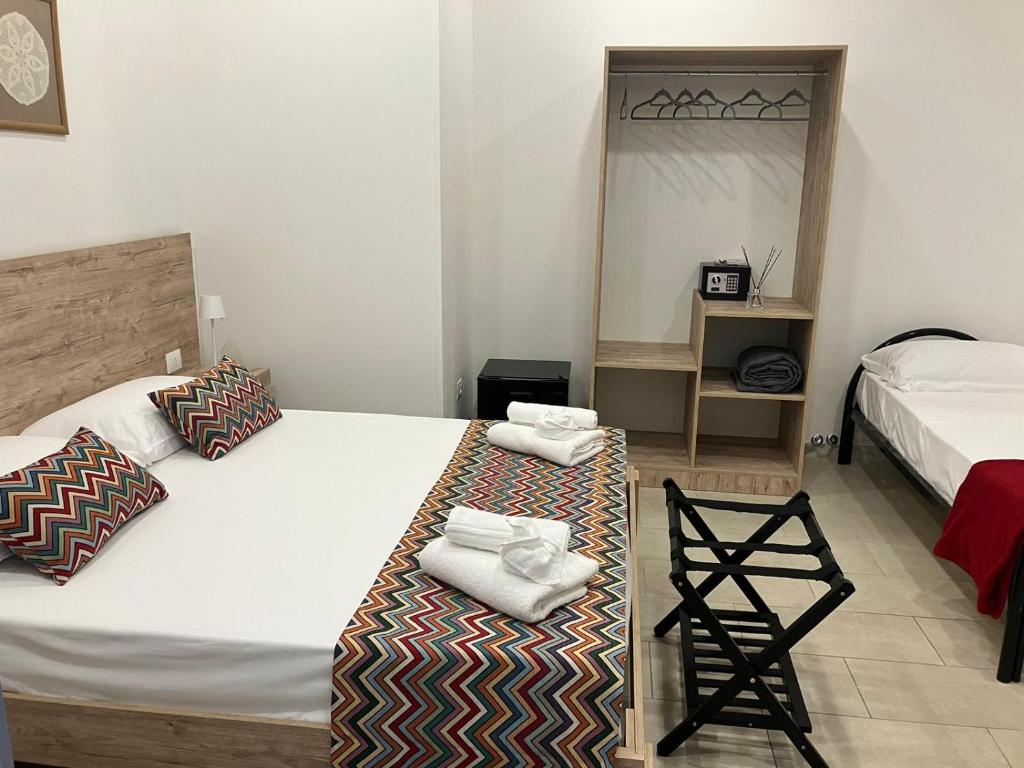 Postel nebo postele na pokoji v ubytování Frontemare 25 Beach Hotel