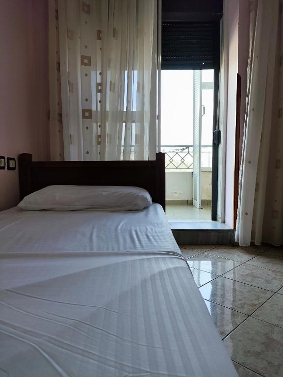 Postel nebo postele na pokoji v ubytování Koshi Home