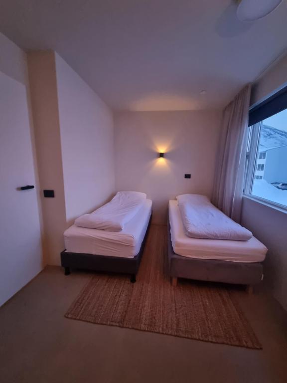 Postel nebo postele na pokoji v ubytování Dúfan Apartments