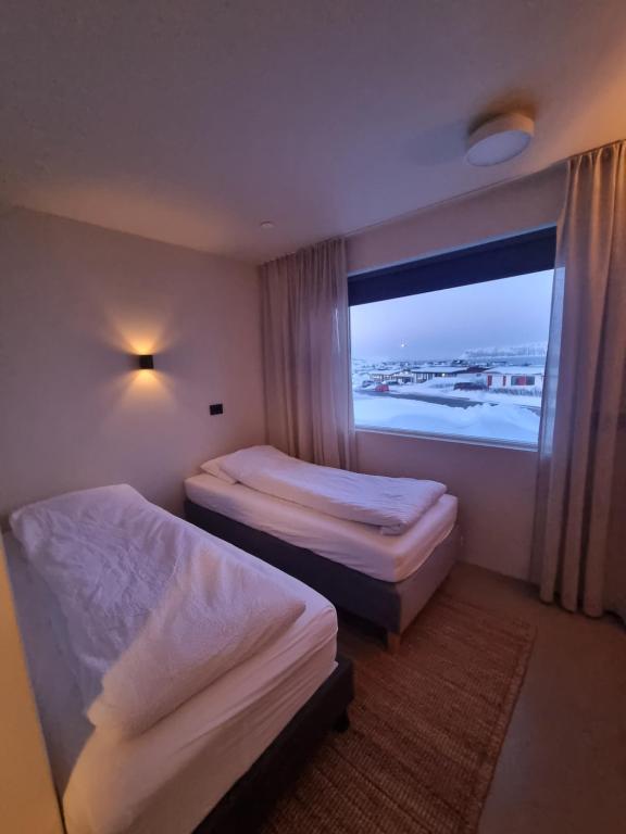 Postel nebo postele na pokoji v ubytování Dúfan Apartments