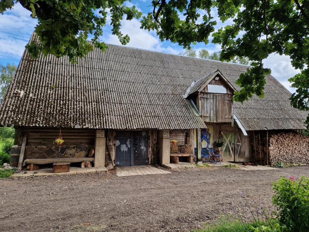 an old house with a thatched roof at Zemnieku saimniecība Paldaži in Limbaži