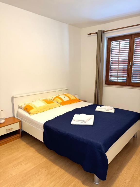 Postel nebo postele na pokoji v ubytování Apartment Gitara