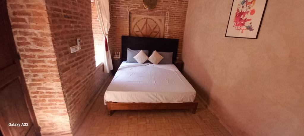 Postel nebo postele na pokoji v ubytování Riad maison Bounouar