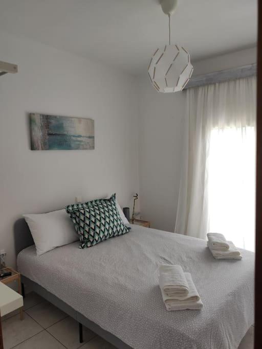 A bed or beds in a room at Sun 'n Sand, dream it in Possidi