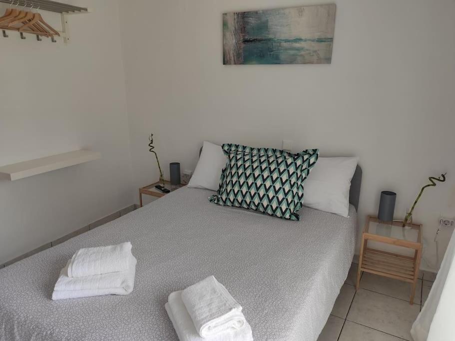 A bed or beds in a room at Sun 'n Sand, dream it in Possidi