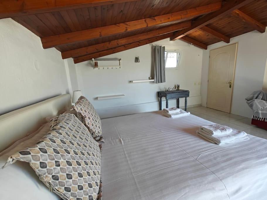 A bed or beds in a room at Sun 'n Sand, dream it in Possidi