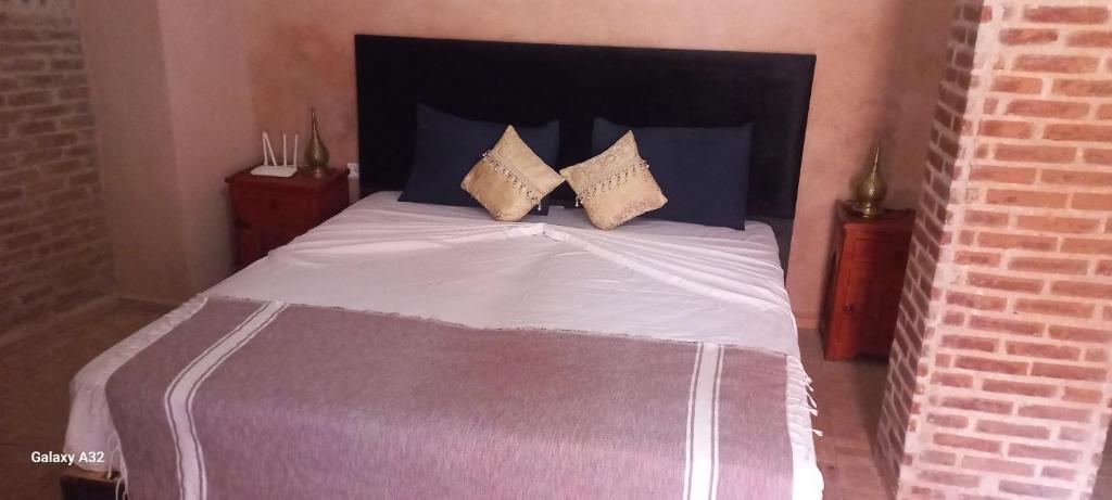 Postel nebo postele na pokoji v ubytování Riad maison Bounouar