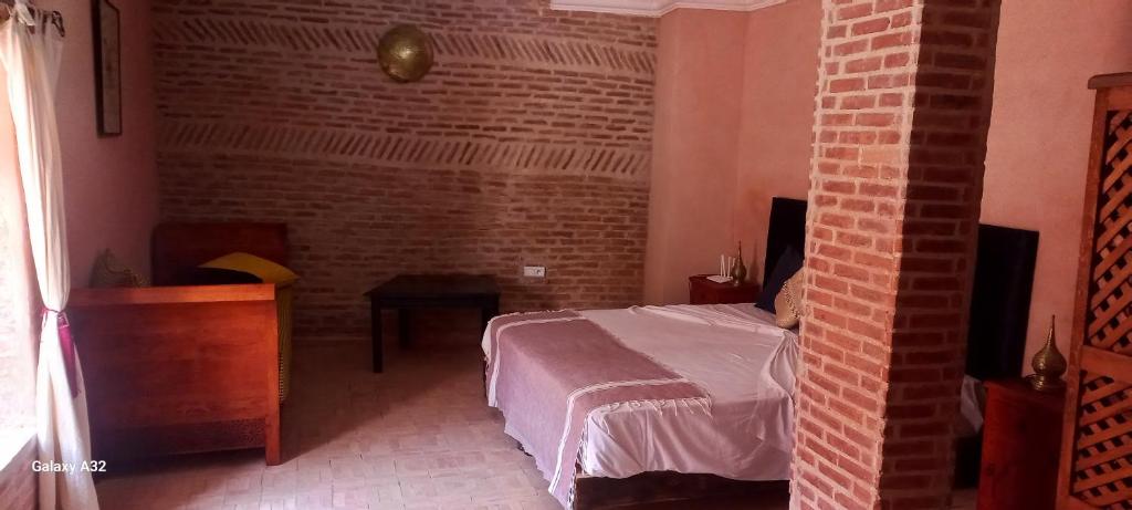 Postel nebo postele na pokoji v ubytování Riad maison Bounouar