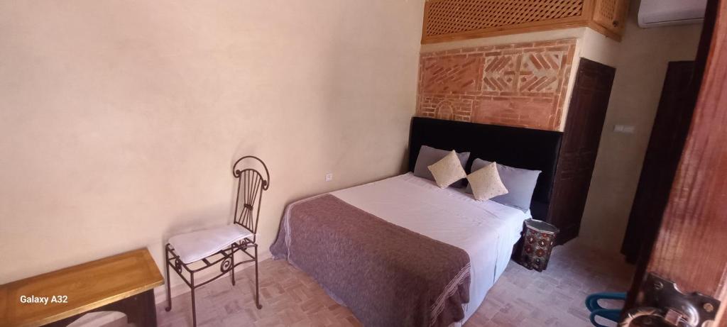 Postel nebo postele na pokoji v ubytování Riad maison Bounouar