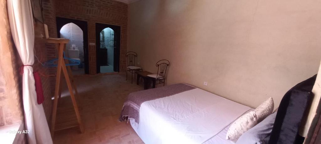 Postel nebo postele na pokoji v ubytování Riad maison Bounouar