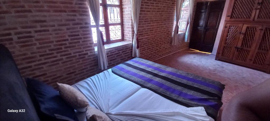Postel nebo postele na pokoji v ubytování Riad maison Bounouar