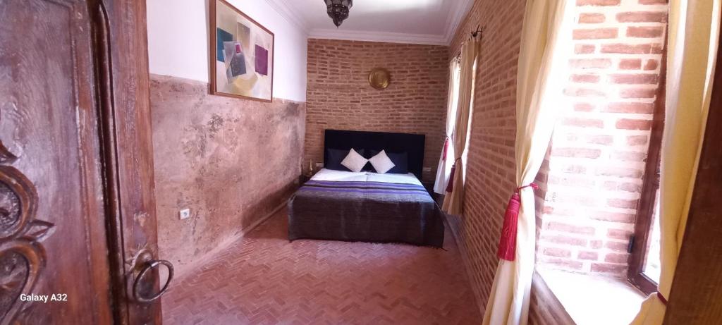 Postel nebo postele na pokoji v ubytování Riad maison Bounouar
