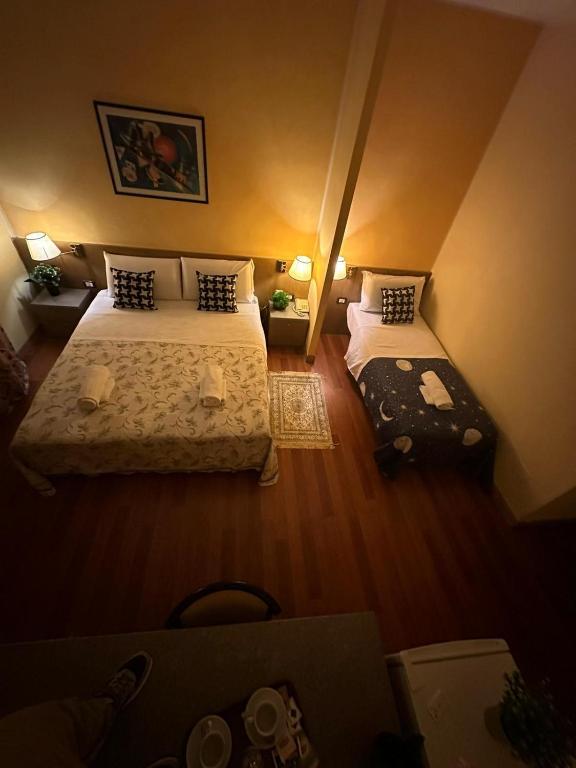 Postel nebo postele na pokoji v ubytování Hotel Raffaello Venice