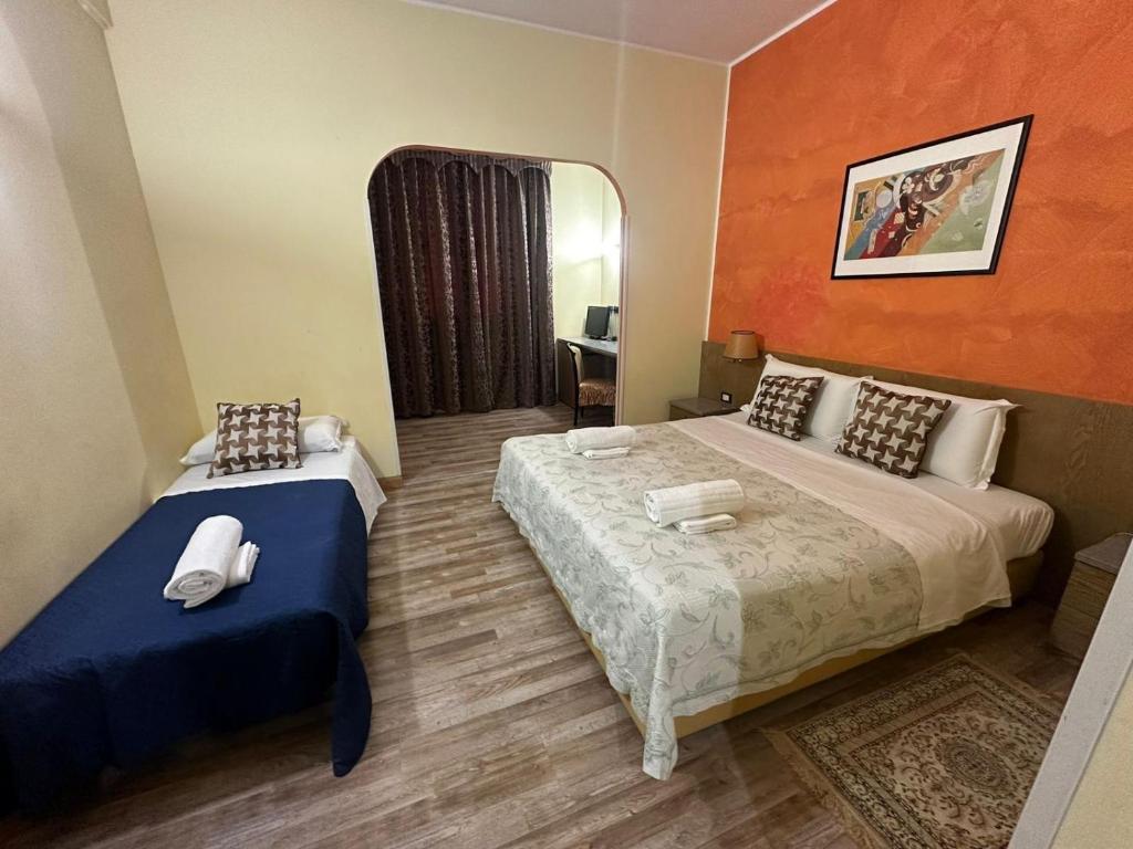Postel nebo postele na pokoji v ubytování Hotel Raffaello Venice