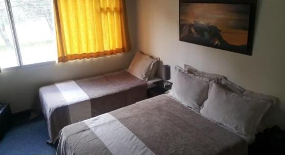 Postel nebo postele na pokoji v ubytování Greco Boutique Hotel