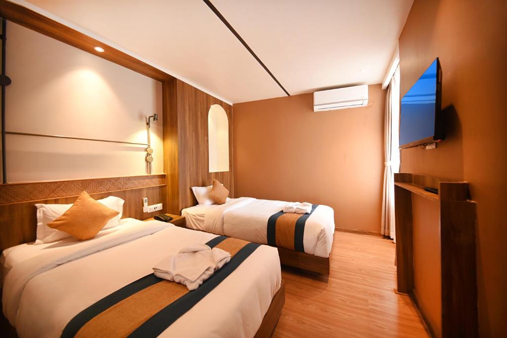 Letto o letti in una camera di Hotel Vistara