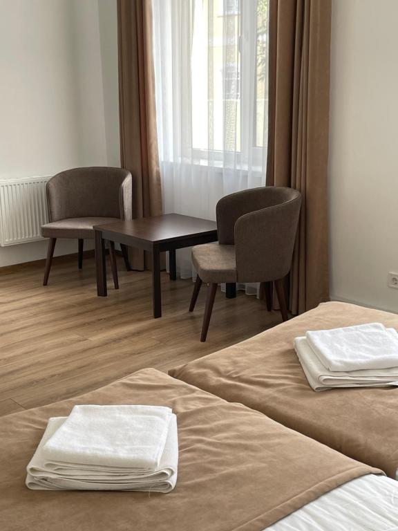 Postel nebo postele na pokoji v ubytování Leo Rooms