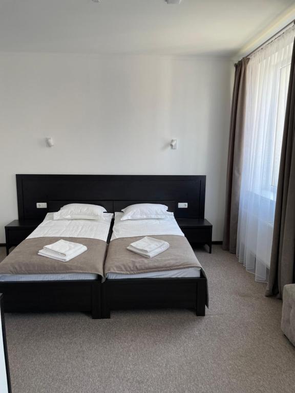 Postel nebo postele na pokoji v ubytování Leo Rooms