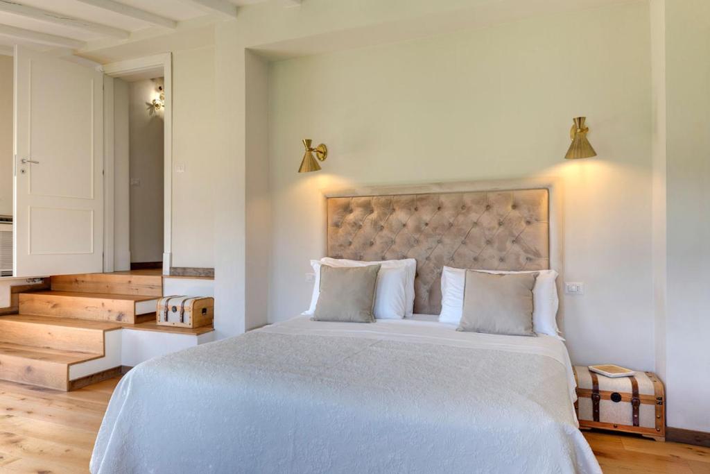 Łóżko lub łóżka w pokoju w obiekcie AMORE RENTALS - Villa Mia