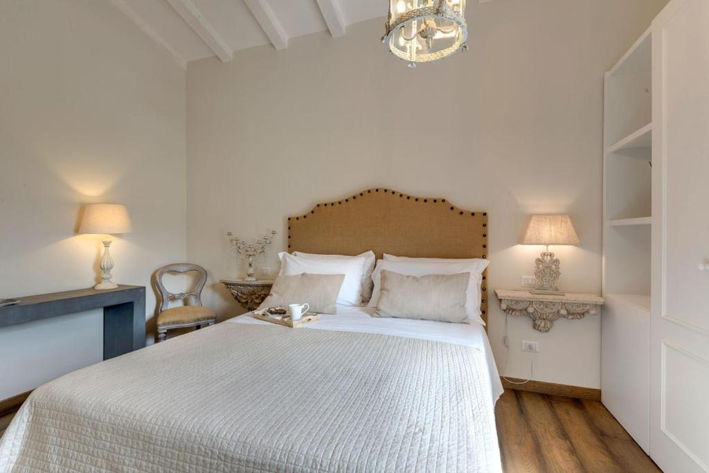 Łóżko lub łóżka w pokoju w obiekcie AMORE RENTALS - Villa Mia