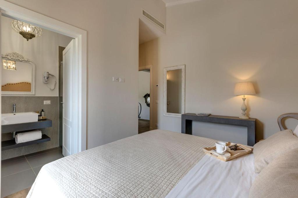 Łóżko lub łóżka w pokoju w obiekcie AMORE RENTALS - Villa Mia