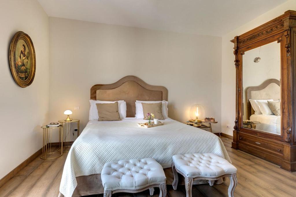Łóżko lub łóżka w pokoju w obiekcie AMORE RENTALS - Villa Mia
