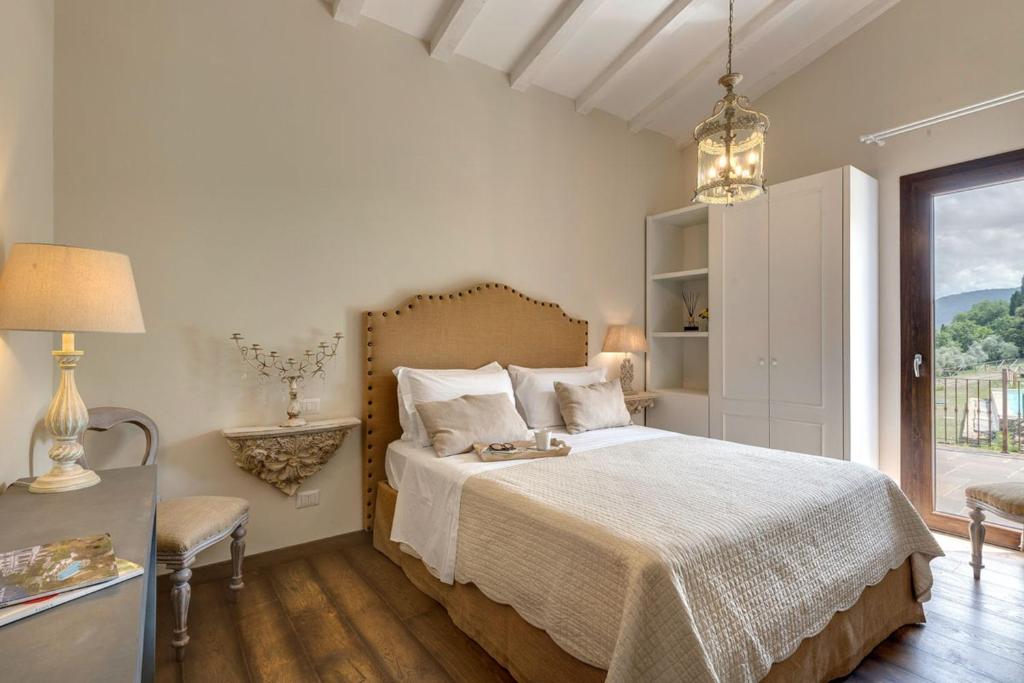 Łóżko lub łóżka w pokoju w obiekcie AMORE RENTALS - Villa Mia