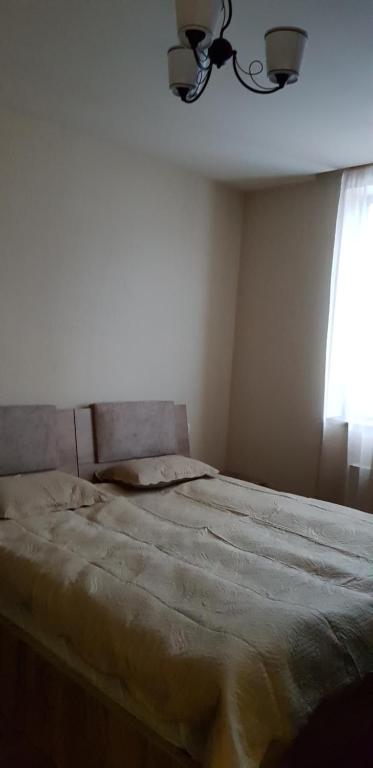 Postel nebo postele na pokoji v ubytování Cozy Hotel in Bakuriani