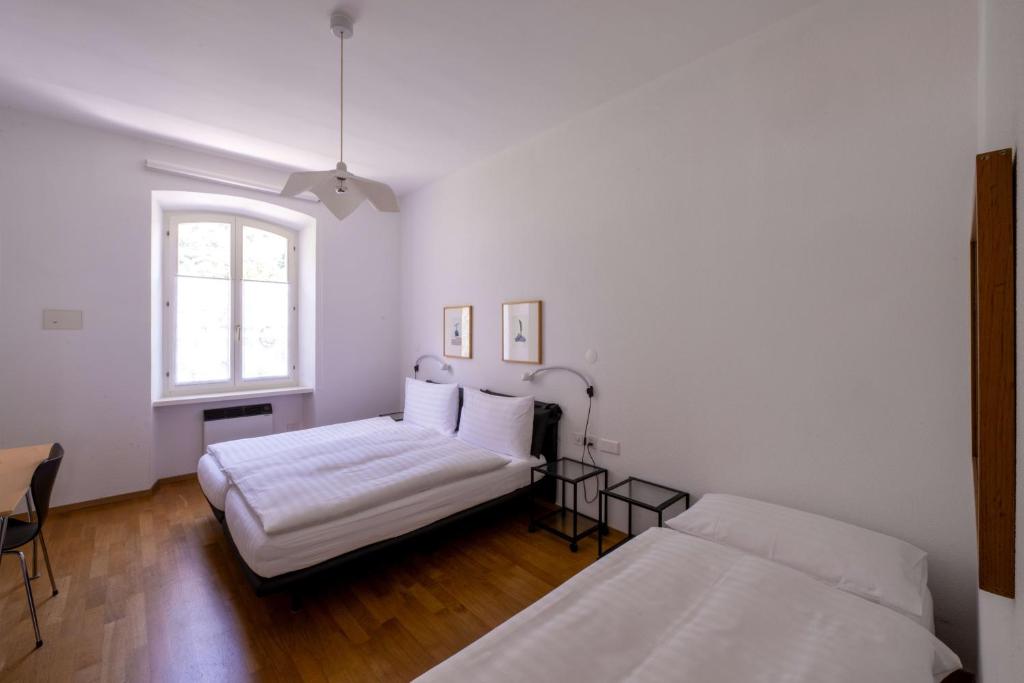 Postel nebo postele na pokoji v ubytování Albergo Ristorante Centovalli