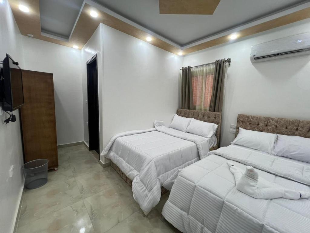 Cama o camas de una habitación en Aladdin Pyramids destination