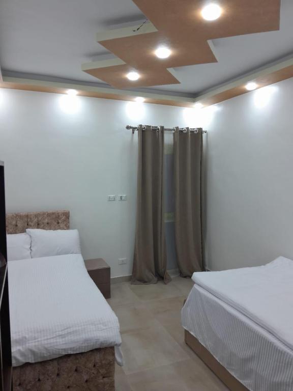 Cama o camas de una habitación en Aladdin Pyramids destination