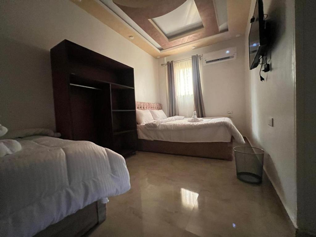 Cama o camas de una habitación en Aladdin Pyramids destination