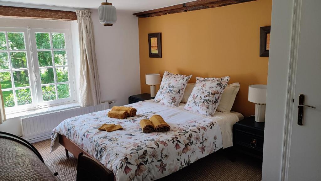 Postel nebo postele na pokoji v ubytování Le moulin Grenon