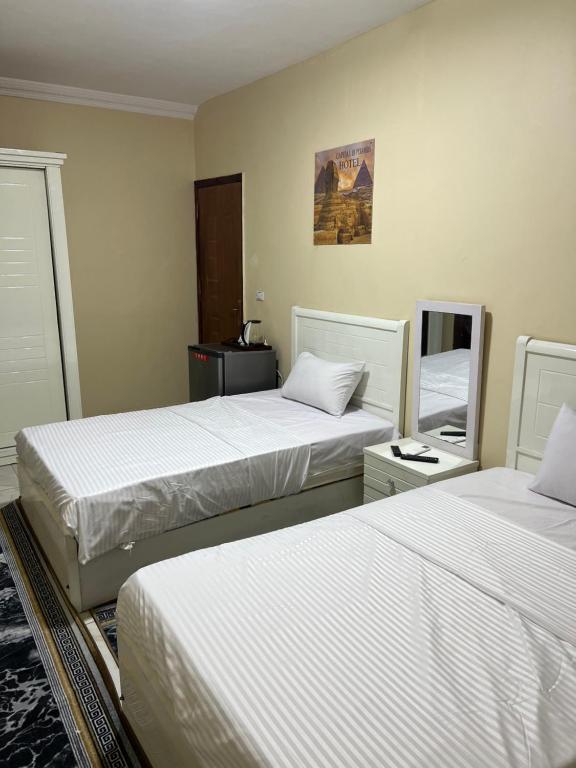 Postel nebo postele na pokoji v ubytování wadi El Muloak house