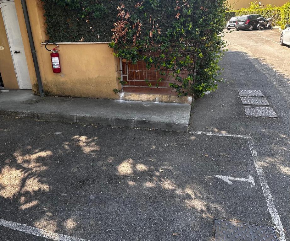 a building with a gate on the side of a street at Casa di Nia Pietralata in Rome