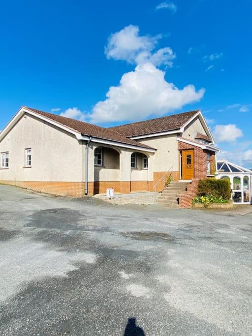 a shadow of a man standing in front of a building at Valley Lodge 3 BR Retreat in Craigantlet Hills in Belfast