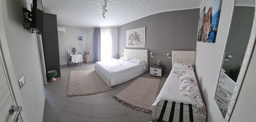 Posteľ alebo postele v izbe v ubytovaní La Regina Di Saba