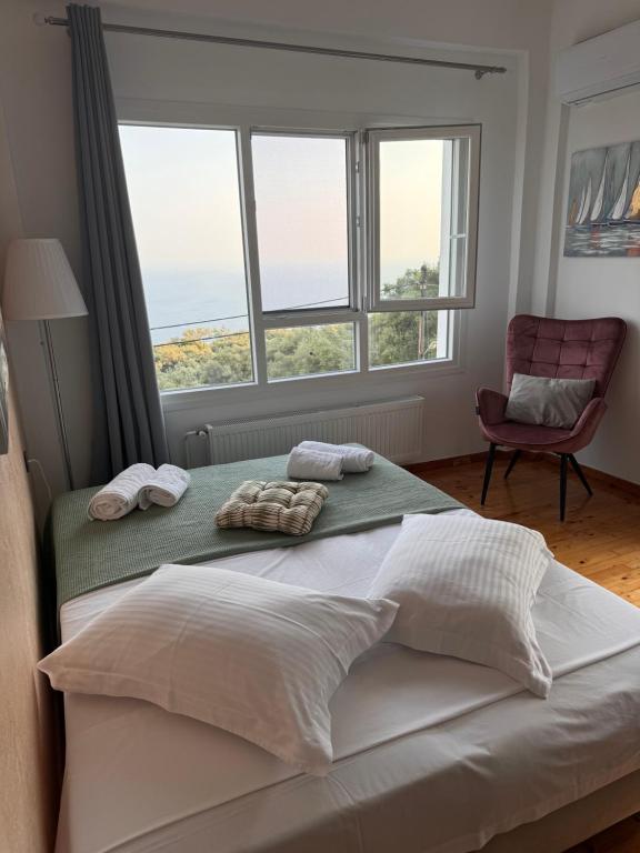 Postel nebo postele na pokoji v ubytování Anemos Apartment
