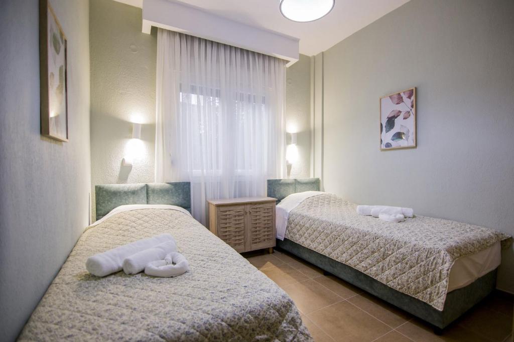Postel nebo postele na pokoji v ubytování Villa Avra